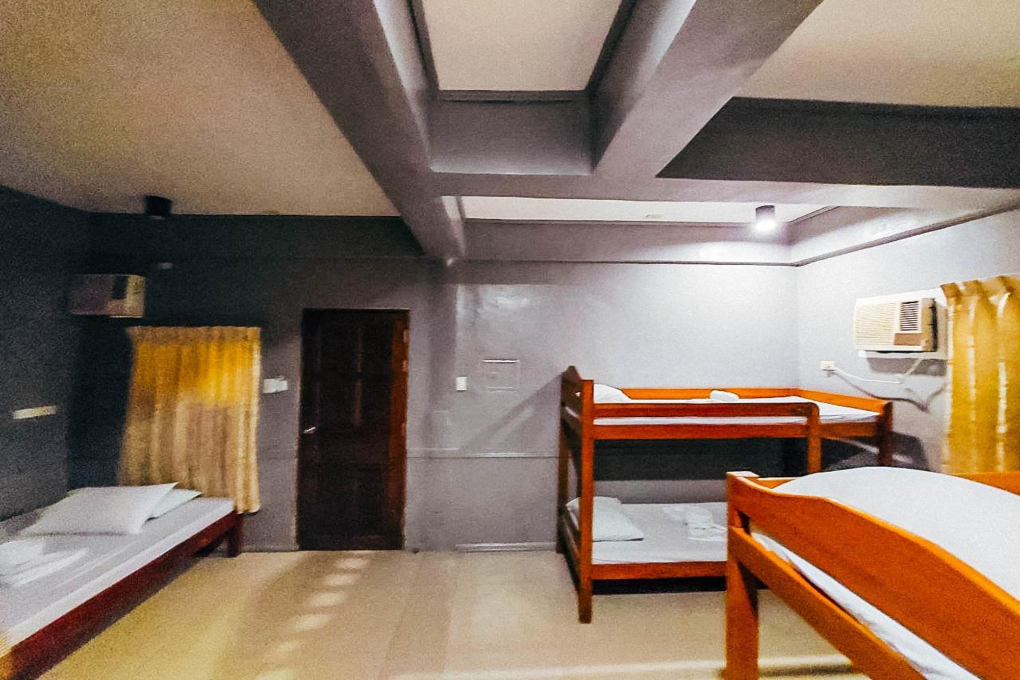 Mbg Travellers Inn Powered By Cocotel Puerto Princesa Quarto foto