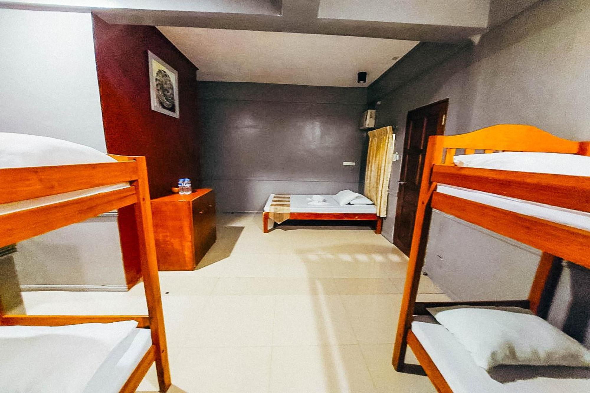 Mbg Travellers Inn Powered By Cocotel Puerto Princesa Quarto foto