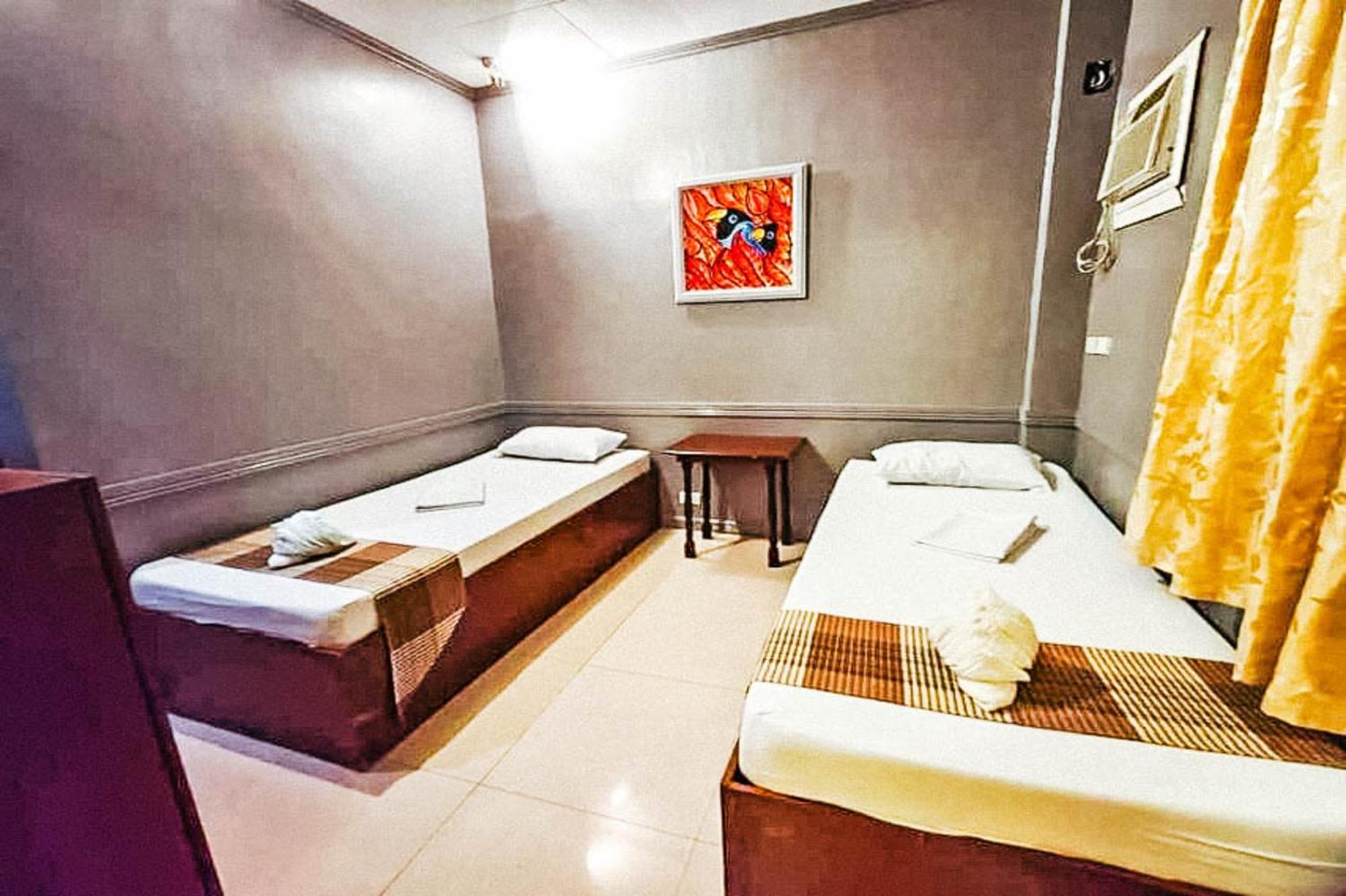 Mbg Travellers Inn Powered By Cocotel Puerto Princesa Quarto foto