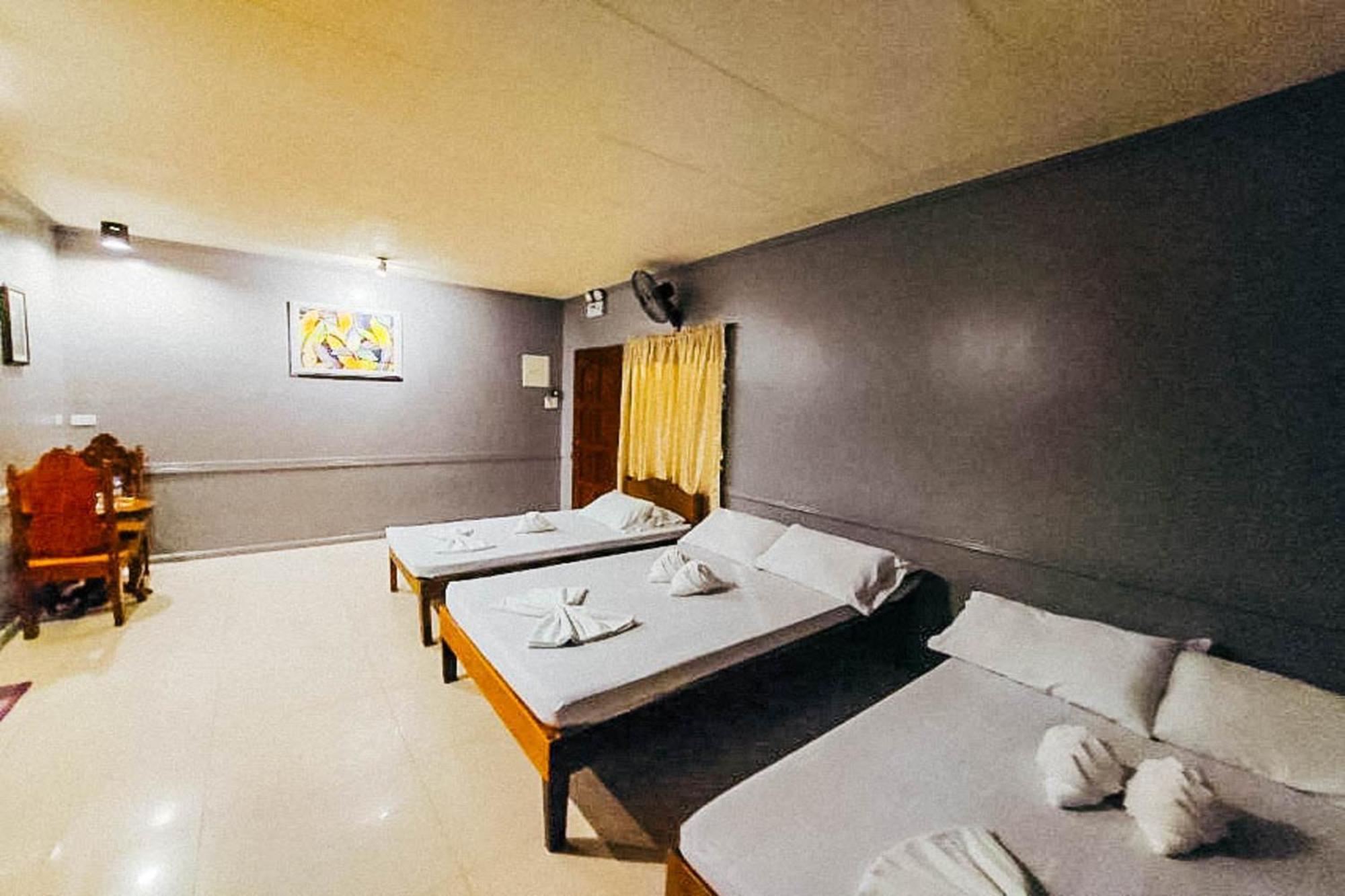 Mbg Travellers Inn Powered By Cocotel Puerto Princesa Quarto foto