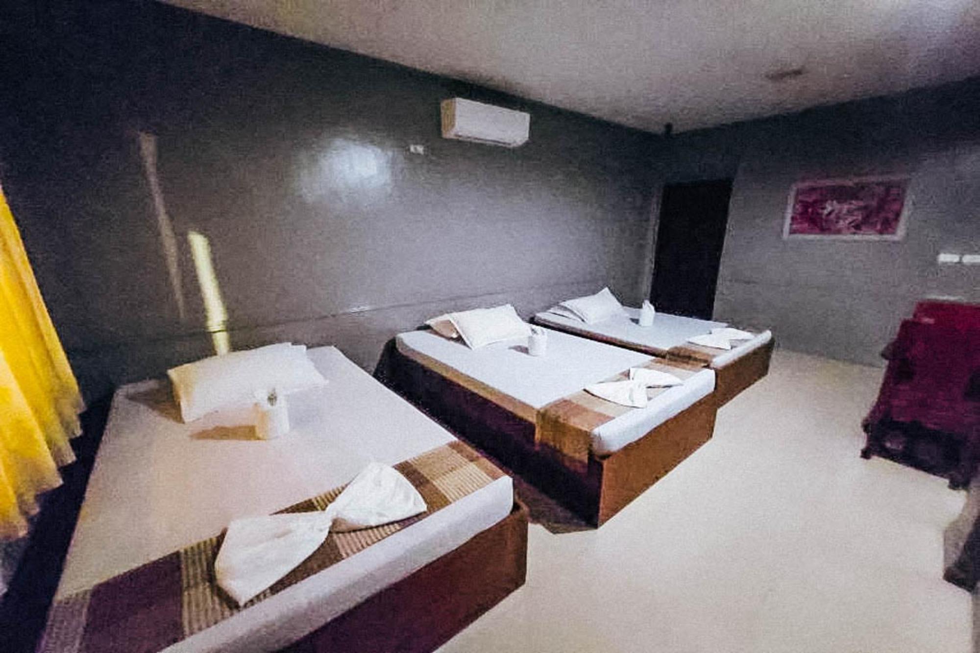 Mbg Travellers Inn Powered By Cocotel Puerto Princesa Quarto foto
