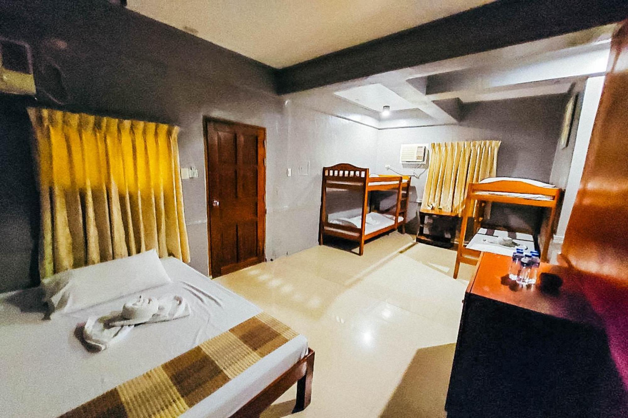 Mbg Travellers Inn Powered By Cocotel Puerto Princesa Quarto foto