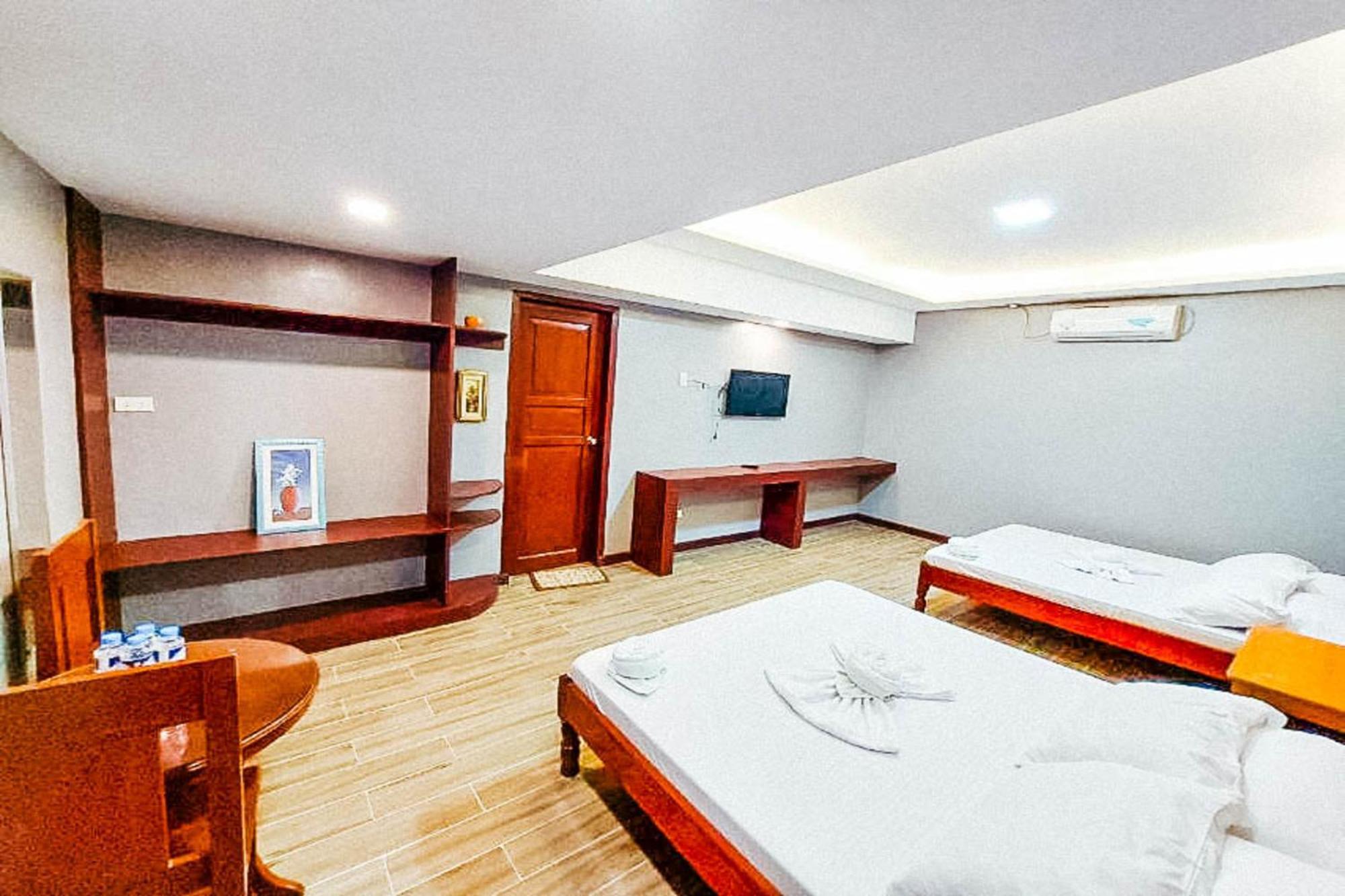 Mbg Travellers Inn Powered By Cocotel Puerto Princesa Quarto foto