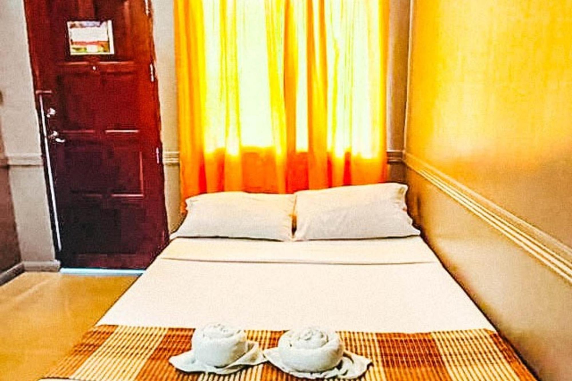 Mbg Travellers Inn Powered By Cocotel Puerto Princesa Quarto foto