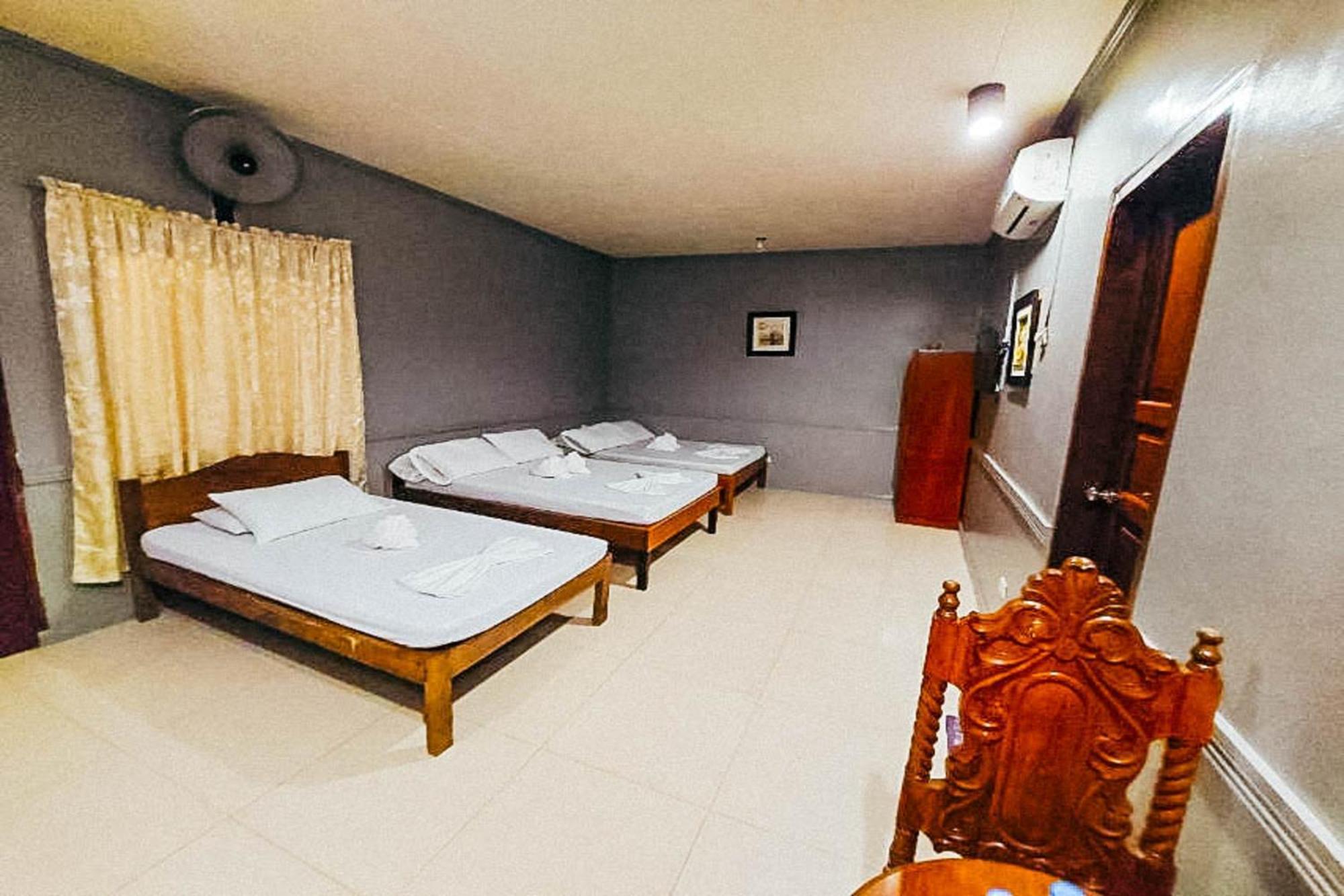 Mbg Travellers Inn Powered By Cocotel Puerto Princesa Quarto foto