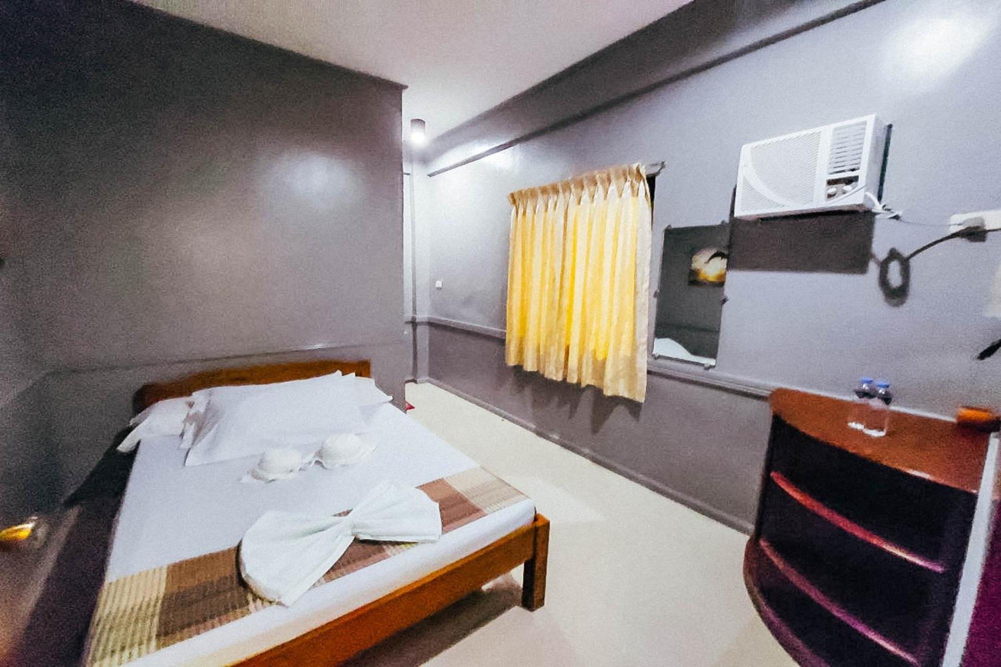 Mbg Travellers Inn Powered By Cocotel Puerto Princesa Quarto foto