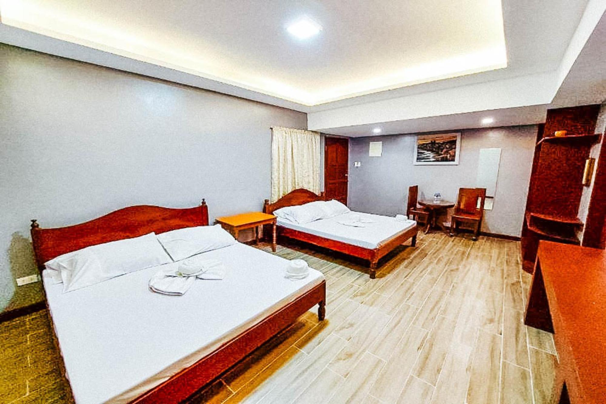 Mbg Travellers Inn Powered By Cocotel Puerto Princesa Quarto foto