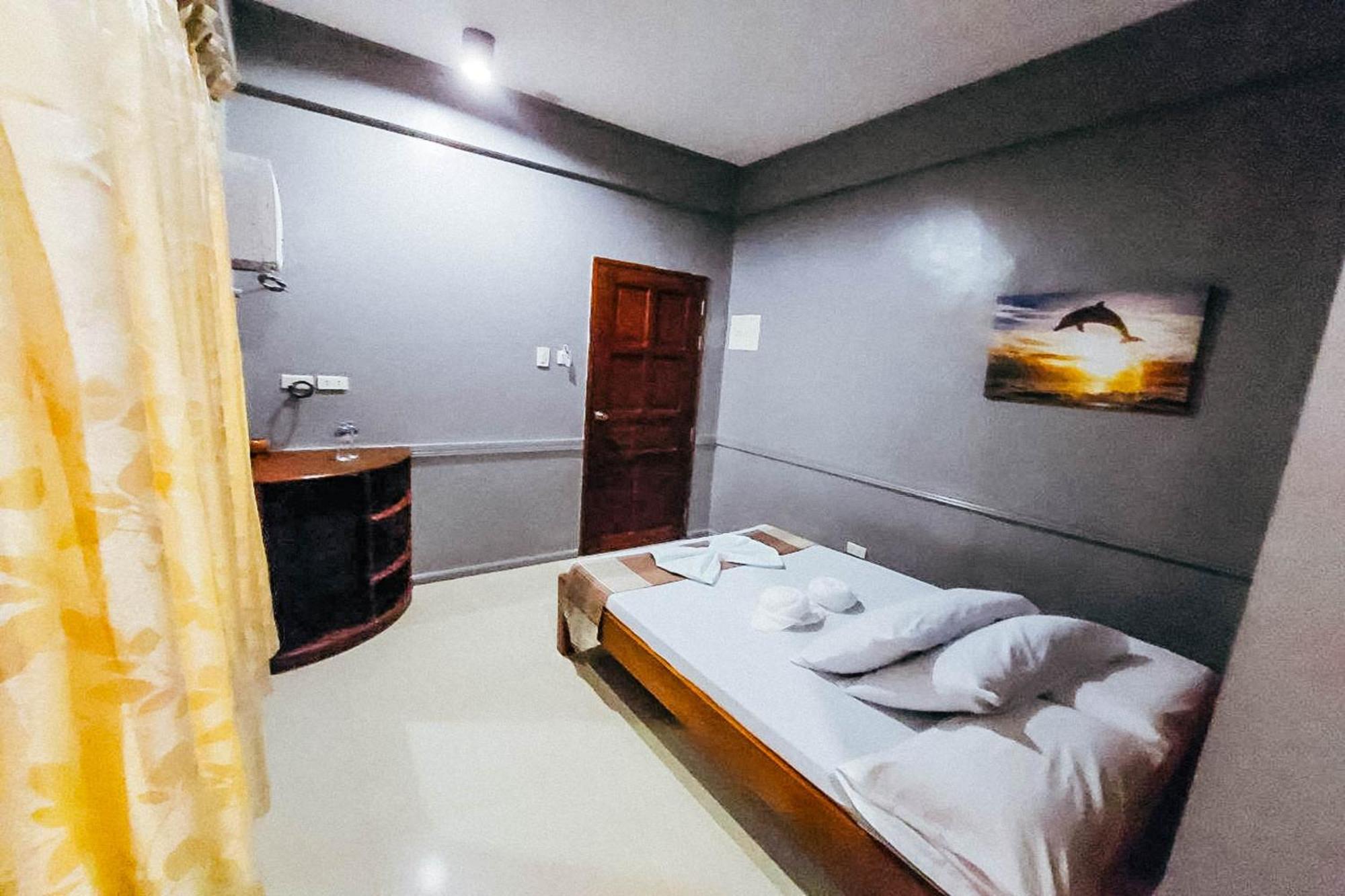 Mbg Travellers Inn Powered By Cocotel Puerto Princesa Quarto foto